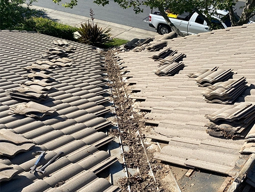 Dirty valley flashing on Lincoln tile roof.